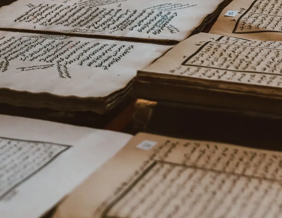 Illustrative photo of aged manuscripts and books with Arabic script